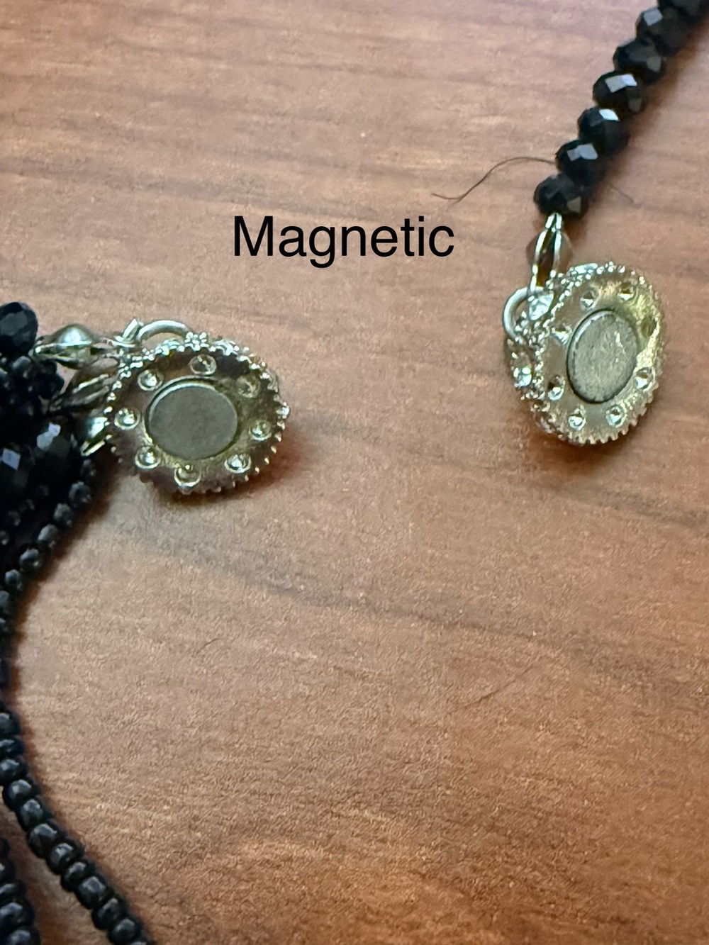 Multi-Strand Black Beaded Necklace with Magnetic Decorative Accents